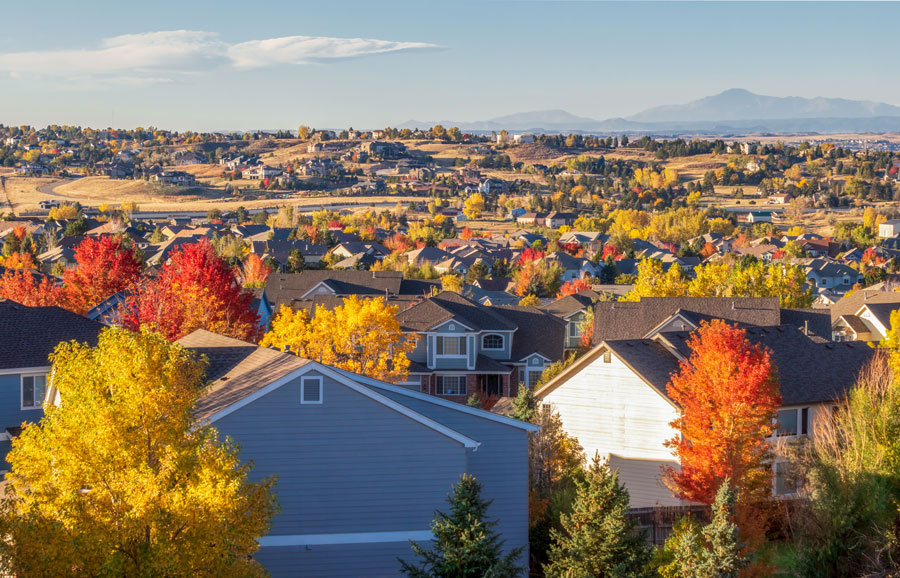 Panorama of residential Centennial Colorado - Denver Metro area - in autumn with a view of the Front Range mountains in the distance.