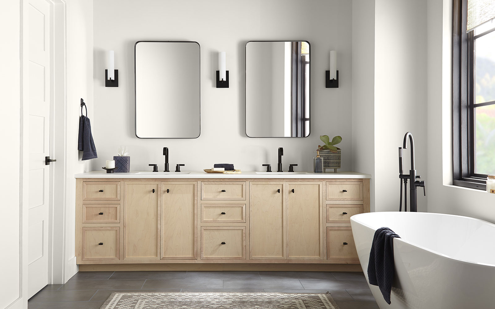 A modern bathroom with walls painted in the Behr 2023 color of the year, Blank Canvas