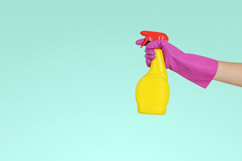 Hand spraying a cleaning bottle