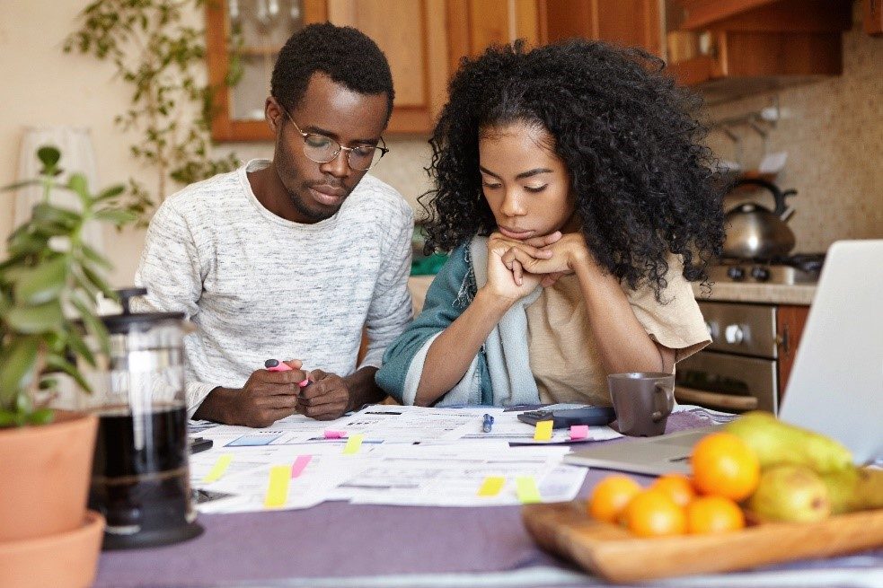 Young couple planning budget after moving