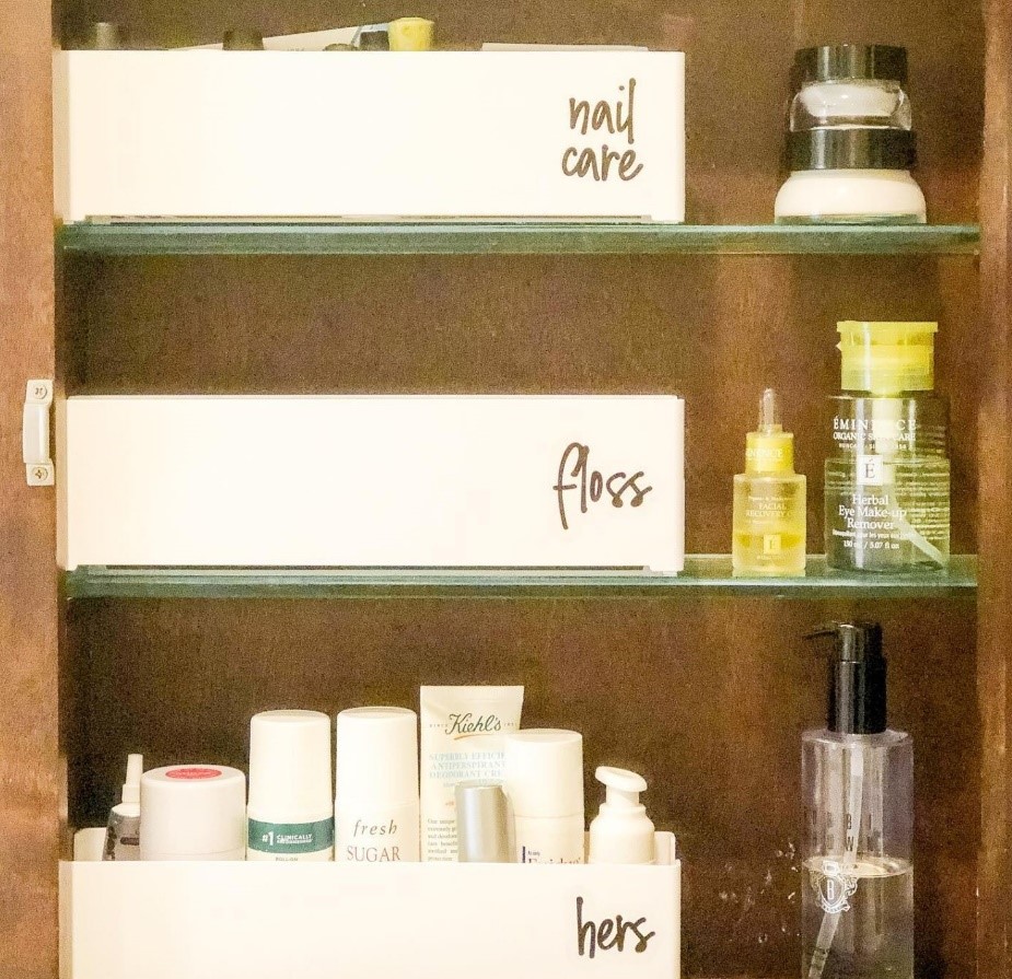 Bathroom cabinet utilizing bins to declutter products
