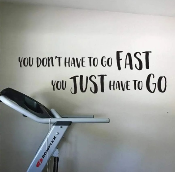 Motivating home gym wall decal that says "You don't have to go fast, you just have to go."