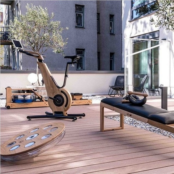 Outdoor gym set up on the terrace of an apartment complex or condo.