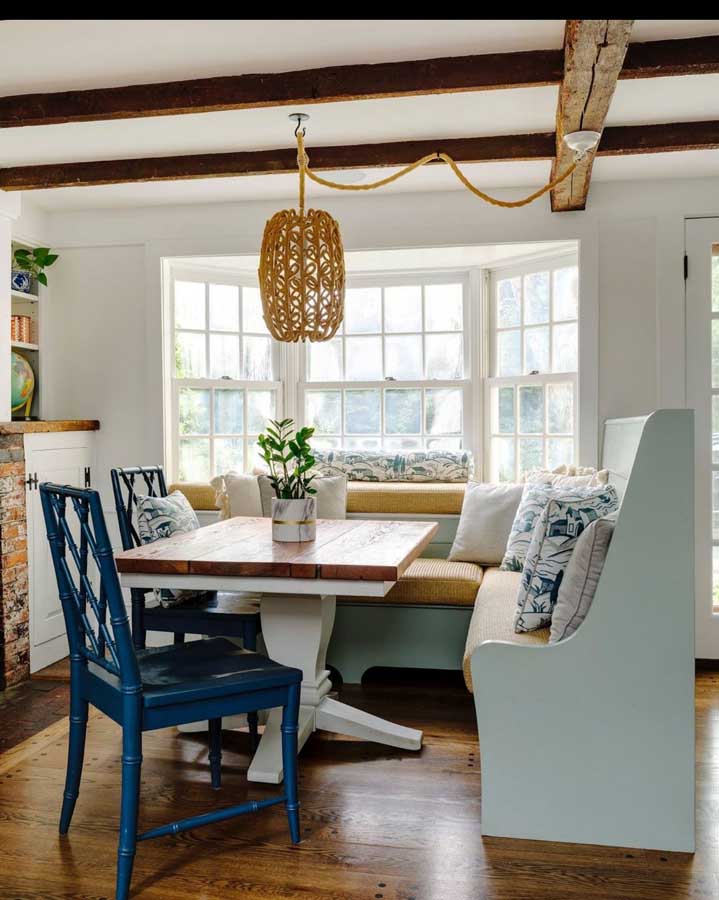 Cozy breakfast nook with rustic blue wood bench seating