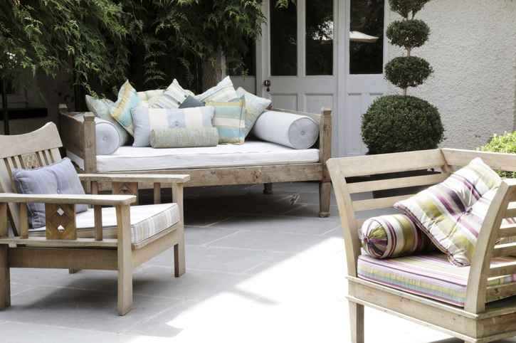 outside seating area, patio furniture with cushions