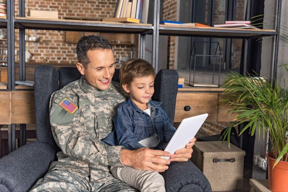 A military family enjoying themselves at home