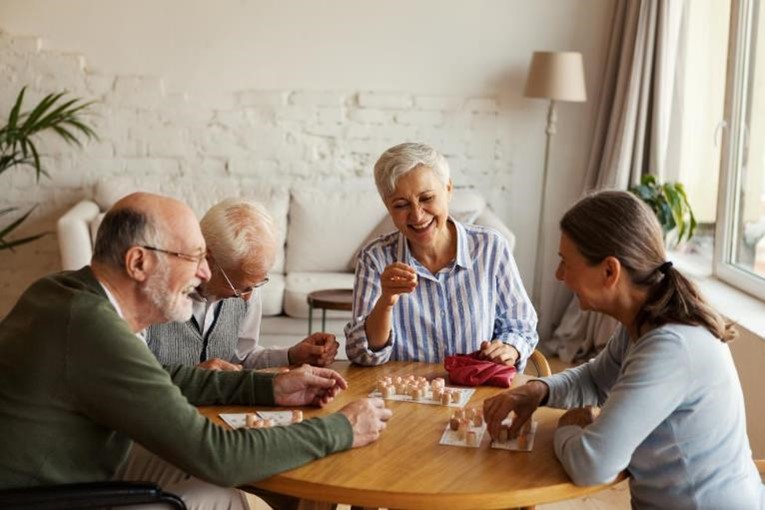 A group of seniors playing games at a table