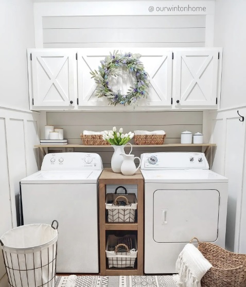 A neatly organized laundry room with a farmhouse theme