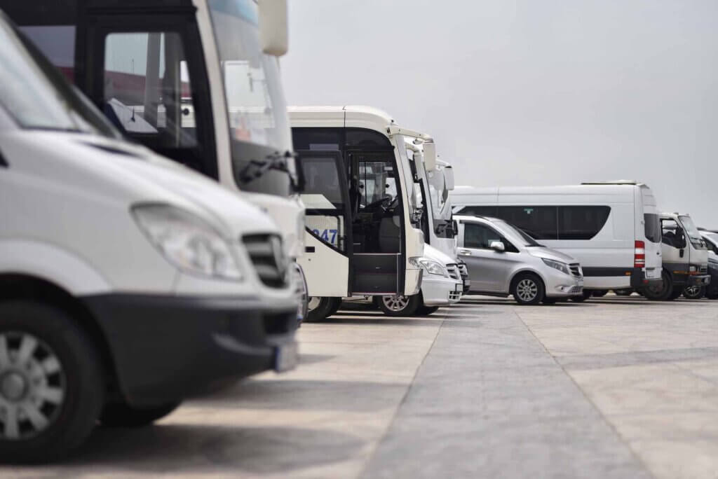 buses and minibuses shuttles taxi parked in row