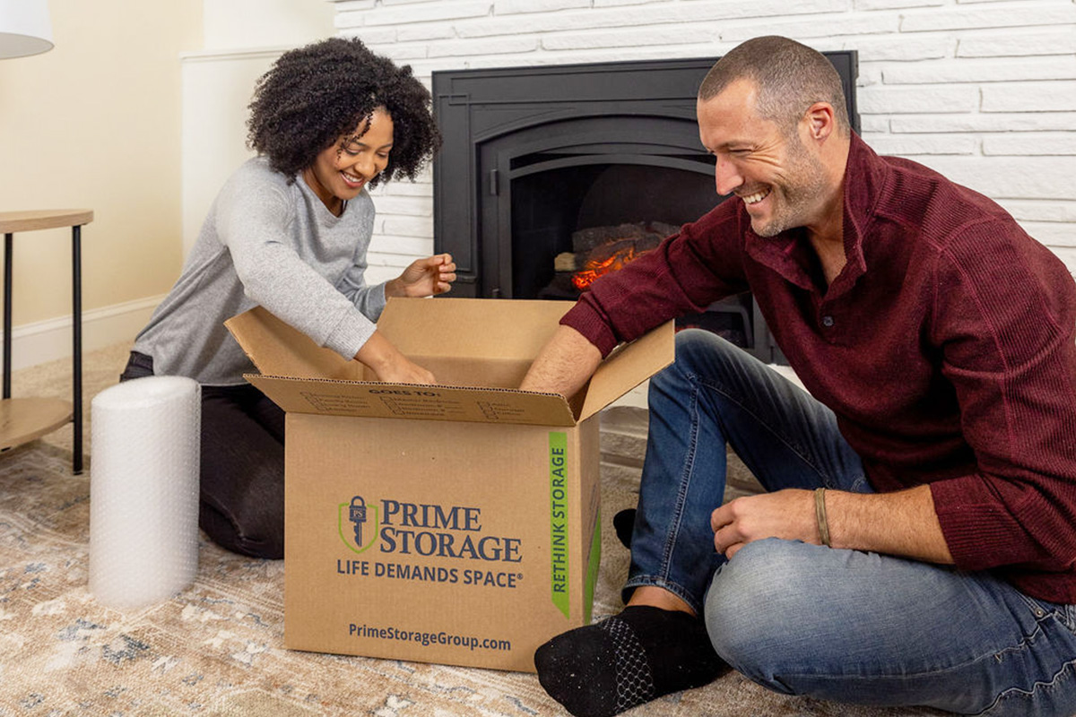 A happy couple storing their home goods